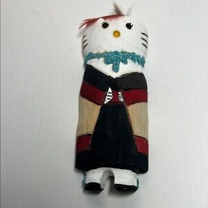 Handcrafted Zuni cat female figurine with Red and Black Accents.